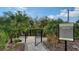 Community dog park, with secure fencing, palm trees, and open space for pets to exercise and play at 5548 Summit Gln, Bradenton, FL 34203