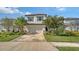 Charming two-story home with a well-manicured lawn and a two-car garage at 5548 Summit Gln, Bradenton, FL 34203