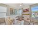 Inviting living room featuring ample natural light, modern decor, and stylish furnishings at 5548 Summit Gln, Bradenton, FL 34203