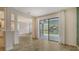 Open-concept living area featuring tile floors and sliding glass doors to the backyard at 5548 Summit Gln, Bradenton, FL 34203