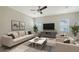 Living room with neutral furnishings, a ceiling fan, and lots of natural light at 5548 Summit Gln, Bradenton, FL 34203