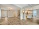 Open-concept living space showcasing seamless flow between the living room and kitchen, ideal for entertaining at 5548 Summit Gln, Bradenton, FL 34203