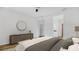 Spacious main bedroom featuring a dresser with decor and ensuite bathroom at 5548 Summit Gln, Bradenton, FL 34203
