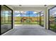 Covered patio overlooking a backyard with a playground at 5548 Summit Gln, Bradenton, FL 34203