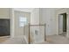 Upstairs hallway with a chalkboard accent wall and a window for natural light at 5548 Summit Gln, Bradenton, FL 34203