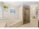 Bathroom features a large walk-in shower and soaking tub at 5628 29Th Street E Cir, Bradenton, FL 34203