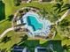 Aerial view of refreshing community pool and lounge area at 5956 7Th W Ave, Bradenton, FL 34209