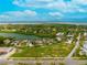 Waterfront lot with direct access to the bay and nearby houses at 597 Buttonwood Dr, Longboat Key, FL 34228