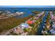Aerial view showcasing the property's waterfront location and surrounding homes at 598 Lyons Ln, Longboat Key, FL 34228
