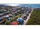 Aerial view of the property and neighborhood, highlighting canal access and water views at 598 Lyons Ln, Longboat Key, FL 34228