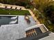 Backyard oasis with pool, fire pit, and lounge chairs at 598 Lyons Ln, Longboat Key, FL 34228