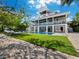 Stunning two-story home with a beautiful pool and lush lawn at 598 Lyons Ln, Longboat Key, FL 34228