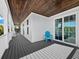 Private balcony with gray decking and white railings at 598 Lyons Ln, Longboat Key, FL 34228