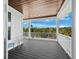 Private balcony overlooking lush greenery and a tranquil landscape at 598 Lyons Ln, Longboat Key, FL 34228