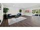 Spacious basement recreation area with comfortable seating and pool access at 598 Lyons Ln, Longboat Key, FL 34228