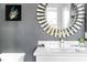 Bathroom with a modern vanity, large mirror, and gray walls at 598 Lyons Ln, Longboat Key, FL 34228
