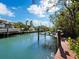 Private dock with boat lift in a tranquil canal setting at 598 Lyons Ln, Longboat Key, FL 34228