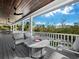 Relaxing deck area with fire pit and outdoor seating at 598 Lyons Ln, Longboat Key, FL 34228