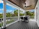Spacious deck with seating area and wooden ceiling at 598 Lyons Ln, Longboat Key, FL 34228