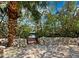 Brick pathway leads to waterfront dock and canal access at 598 Lyons Ln, Longboat Key, FL 34228