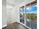 Hallway with sliding glass doors leading to a private balcony with an ocean view at 598 Lyons Ln, Longboat Key, FL 34228