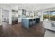 Modern kitchen with stainless steel appliances and a large island at 598 Lyons Ln, Longboat Key, FL 34228