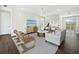 Relaxing living room with comfortable seating and hardwood floors at 598 Lyons Ln, Longboat Key, FL 34228