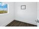 Bright and airy home office with large window and hardwood floors at 598 Lyons Ln, Longboat Key, FL 34228