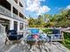 Fire pit and lounge chairs near the pool at 598 Lyons Ln, Longboat Key, FL 34228