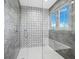 Large walk-in shower with patterned tile and glass enclosure at 598 Lyons Ln, Longboat Key, FL 34228