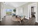 Relaxing sitting area with balcony access, featuring two armchairs and a coffee table at 598 Lyons Ln, Longboat Key, FL 34228