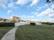 Scenic community view overlooking lush green lawn, with several community buildings and waterfront vistas at 6158 Palma Del Mar S Blvd # 306, St Petersburg, FL 33715