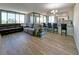 Bright living room with luxury vinyl plank flooring and an open-concept to the kitchen at 6158 Palma Del Mar S Blvd # 306, St Petersburg, FL 33715