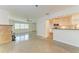 Spacious living room with a fireplace and terrazzo flooring at 6280 Uplands Blvd, Sarasota, FL 34243