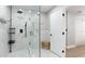 Spa-like bathroom with glass shower and marble walls at 6311 1St W Ave, Bradenton, FL 34209