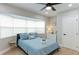 Cozy bedroom with bay window and ceiling fan at 6311 1St W Ave, Bradenton, FL 34209