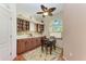 Cozy breakfast nook with a small table, window, and built-in cabinets at 6338 Stone River Rd, Bradenton, FL 34203