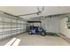 Spacious garage with golf cart and storage shelving at 6338 Stone River Rd, Bradenton, FL 34203