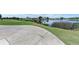 Golf course view with pond and houses in the background at 6338 Stone River Rd, Bradenton, FL 34203