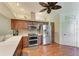 Kitchen with wood cabinets, stainless steel appliances, double oven and tile backsplash at 6338 Stone River Rd, Bradenton, FL 34203