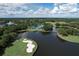 Aerial view showing the community's clubhouse and golf course at 6615 Hunter Combe Xing, University Park, FL 34201