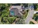 Aerial view of house, pool, and surrounding landscape at 6615 Hunter Combe Xing, University Park, FL 34201