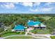 Clubhouse and grounds with lush landscaping and golf course at 6615 Hunter Combe Xing, University Park, FL 34201