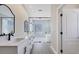Elegant bathroom with double vanity, soaking tub, and large shower at 6615 Hunter Combe Xing, University Park, FL 34201