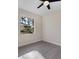 Well-lit bedroom with wood-look floors and a window at 6615 Hunter Combe Xing, University Park, FL 34201