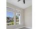 Bright bedroom with large windows and ceiling fan at 6615 Hunter Combe Xing, University Park, FL 34201