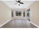 Bright bedroom with wood-look floors and sliding glass doors at 6615 Hunter Combe Xing, University Park, FL 34201
