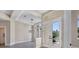Bright and airy entryway with high ceilings, light walls and hardwood floors at 6615 Hunter Combe Xing, University Park, FL 34201