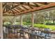 Indoor restaurant with numerous tables and chairs, offering a view of the outdoors at 6615 Hunter Combe Xing, University Park, FL 34201