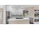 Modern kitchen with white cabinets, quartz countertops, and stainless steel appliances at 6615 Hunter Combe Xing, University Park, FL 34201